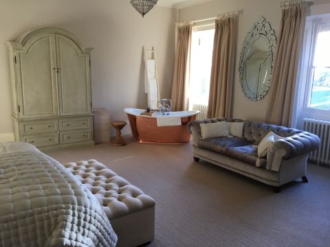 Luxury Hotel Bedroom with Copper Bath