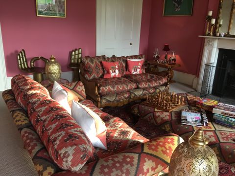 Elegant Living Room with Red Patterned Sofas