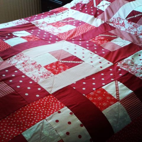 Red and white patchwork bedspread