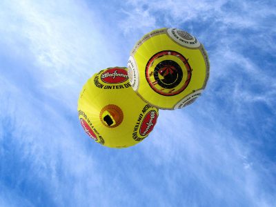 Jigsaw puzzle Jigsaw puzzle Two Yellow Hot Air Balloon with Warsteiner Beer Logo