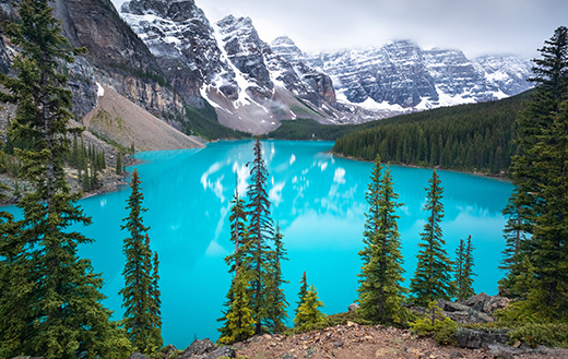 The world-famous glacial blue water and 10 peaks of Moraine Lake in Banff, Canada.