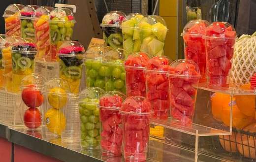 Portions of sliced fruit in cups