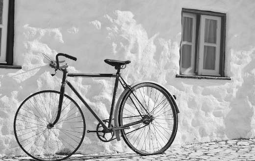 Vintage bike monochrome leaning white wall