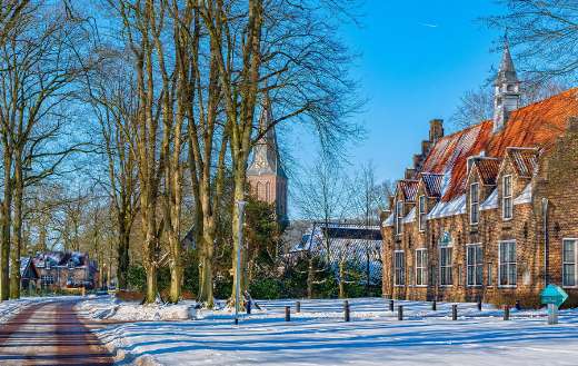 Snowy street scene in Dutch village