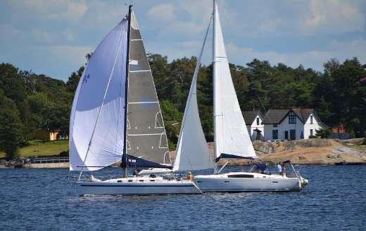 Two sailboats sailing on the water