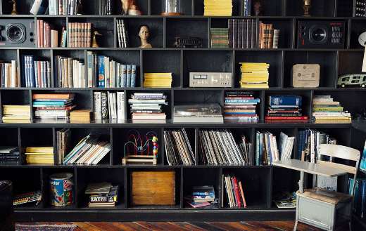 Black open cabinet with books display