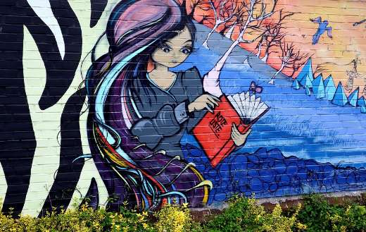 Street art applied to a brick wall