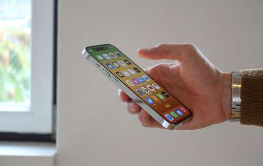 Apple iphone 16 titanium finish held