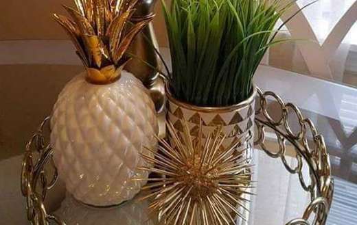 Decorative mirrored serving tray with pineapple plant