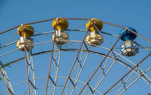 Ferris wheel against blue sky
