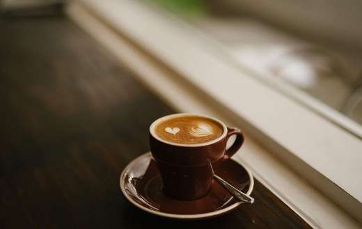 This brown coffee cup and saucer