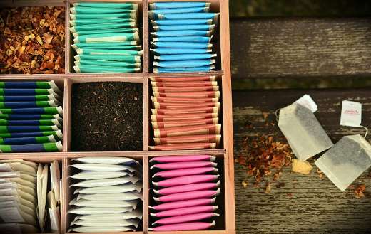 Features assorted colored tea storage box
